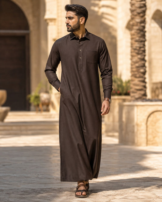 Elite chocolate brown thobe by Al-Emara, featuring traditional long Islamic men's robe with intricate embroidery and comfortable fit.